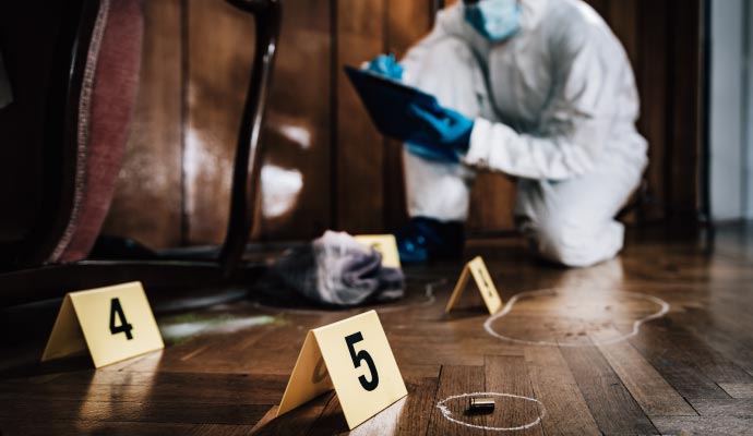 Person cleaning biohazard waste in a restricted area