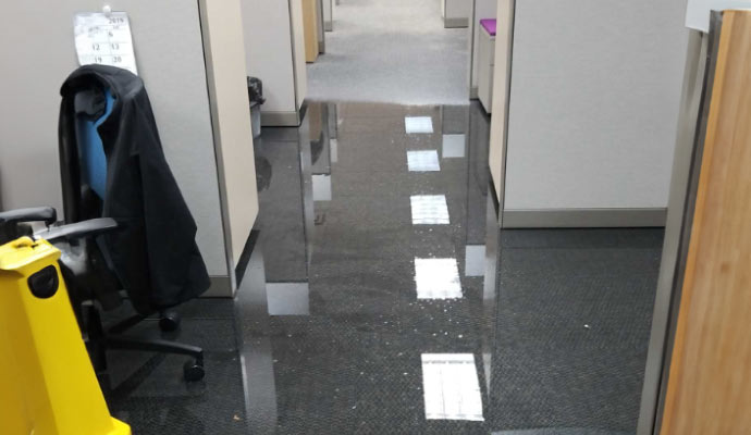 water damaged office room