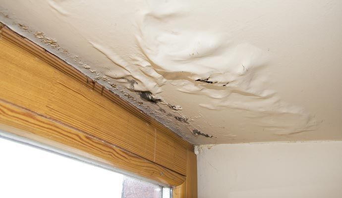 Water-damaged ceiling due to roof leak
