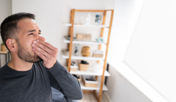 Person sensing bad odor