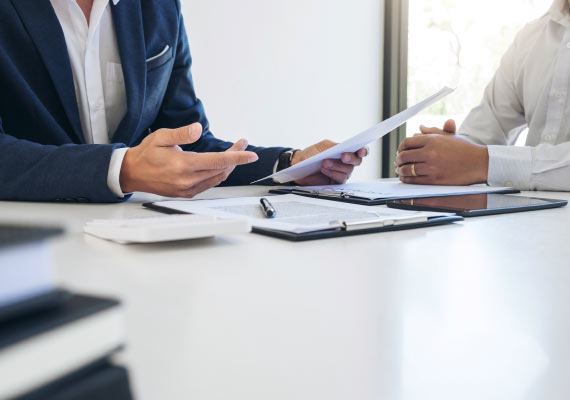 Person discussing insurance claim assistance after property damage