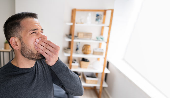 Person sensing bad odor