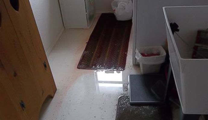 Water damaged bathroom floor